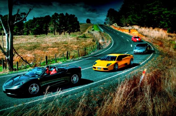  FreemanX Supercars' Queenstown fleet on the open road.